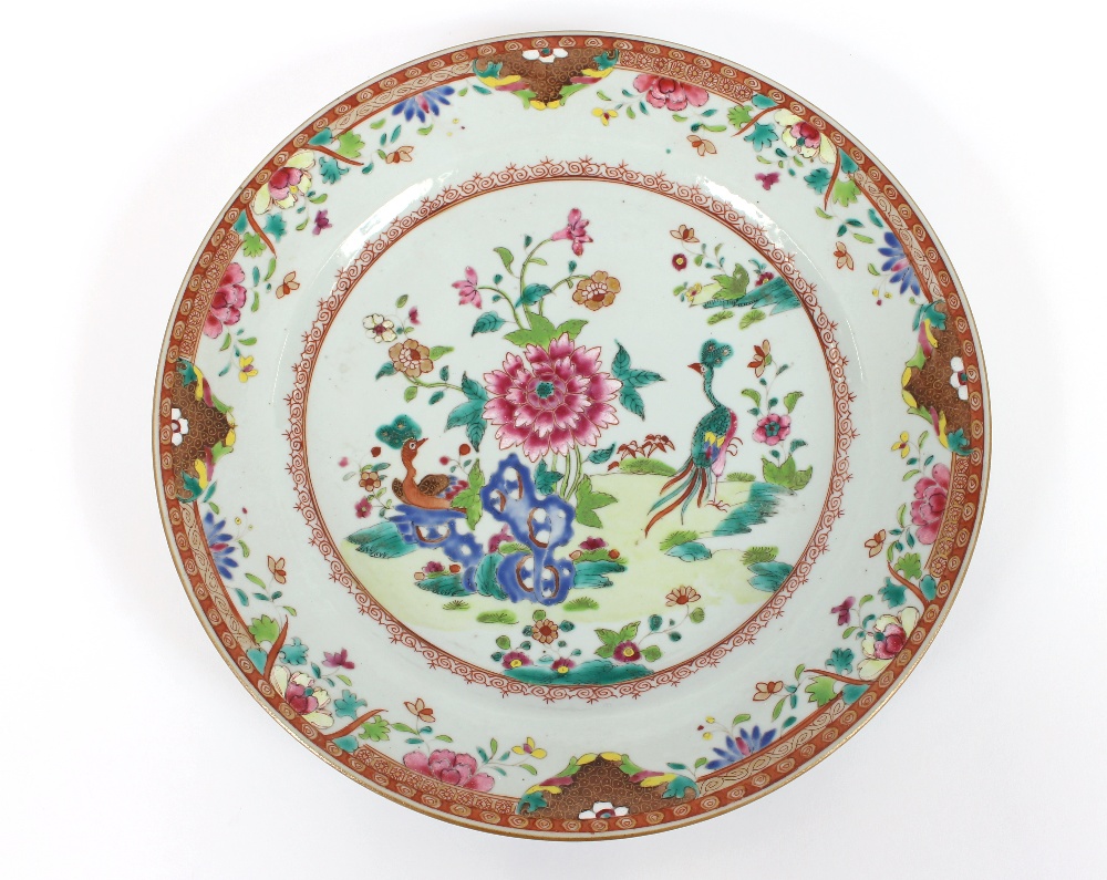 A Canton famille rose plate, decorated with exotic birds and foliage, 28.5cm dia.; a smaller similar