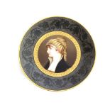A 19th Century Berlin porcelain plate, having finely painted central panel of a young girl within
