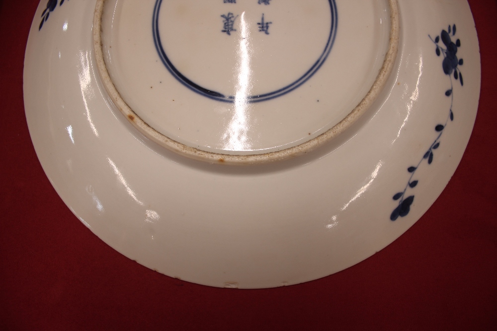 An 18th Century Chinese blue and white plate, the body profusely decorated with exotic birds and - Image 6 of 8