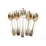 Four various George IV, William IV and Victorian silver Fiddle patterned dessert spoons; and a
