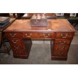 A 19th Century mahogany pedestal writing desk, the leather inset top above three frieze drawers,