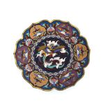 A Chinese cloisonne charger, shaped outline, centre decorated with a phoenix, 30cm dia.