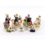 A Victorian Staffordshire figure group, of a highland couple; another similar; another; a