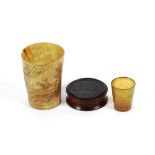 A 19th Century engraved horn hunting beaker; a small hunting beaker engraved with a whale; and a