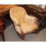 A Victorian walnut framed button back rocking chair, upholstered in floral velour