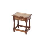 An Antique oak joint stool, the rectangular top raised on turned columns united by stretchers, 46cm