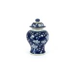 A 19th Century Chinese blue and white baluster vase and cover, with Hawthorn decoration, six