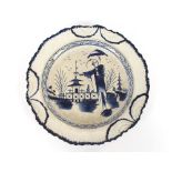 A Pearlware type plate, decorated in the oriental manner with a man beneath a parasol, having