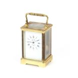 A French brass cased carriage clock, with white enamel dial, signed L'Epee Sainte Suzanne,