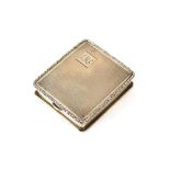 A silver cased travelling watch holder, with engine turned decoration and monogram, containing a