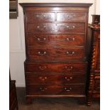 A George III mahogany chest on chest, with dentil cornice above two short and three long drawers