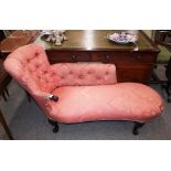 A Victorian mahogany framed chaise longue, with buttoned down floral pink damask upholstery,