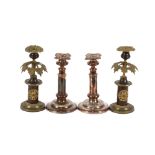 A pair of 19th Century gilt and bronze candlesticks; and a pair of Sheffield plated candlesticks