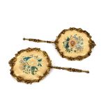A pair of Victorian giltwood face protectors, with printed floral panels