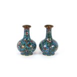 A pair of small 19th Century Chinese turquoise ground and gilded cloisonne vases, decorated with
