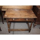An 18th Century oak side table, with overhanging top fitted single drawer, raised on baluster