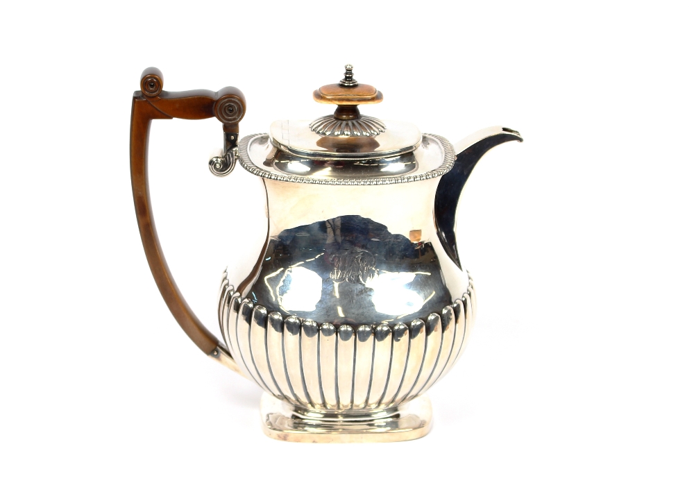 A George III silver baluster coffee pot, maker Samuel Hennell, of half fluted body design with