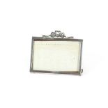 A small George IV silver photograph frame, having ribbon tied decoration, 7.5cm x 9cm overall,