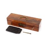 A figured mahogany cigar humidor;  a leather cigar case; and a Sterling silver cigar piercer by