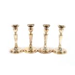 A set of four 20th Century Danish silver candlesticks, raised on oval stepped bases, marked SVT