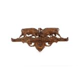 A set of carved wooden coat hooks, in the Black Forest manner, decorated with fighting bulls, 68cm