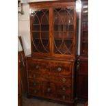 A 19th Century mahogany and inlaid secretaire chest, flanked by spiral columns, the writing drawer