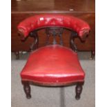 A Victorian tub shaped chair, the curved back raised on carved and pierced brackets, serpentine seat