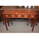 A mahogany side table, fitted five spice drawers, raised on square chamfered supports, 108cm wide