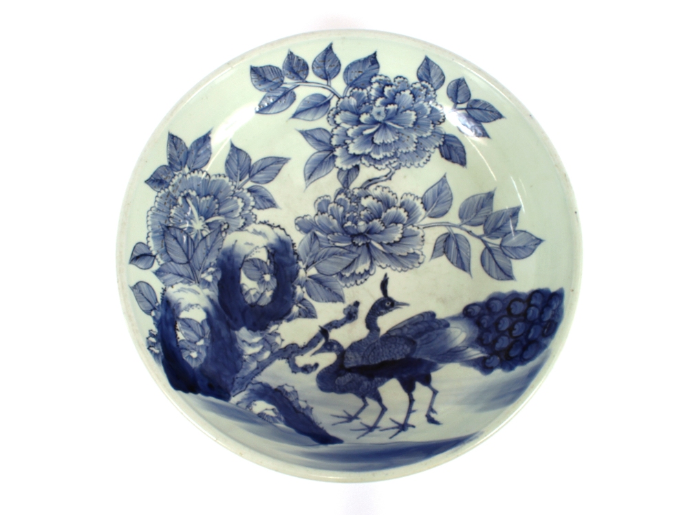 A 19th Century Japanese shallow bowl, decorated with peacocks and foliage, six character mark to