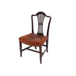 A set of eight George III mahogany dining chairs, having arched cresting rails, pierced fan splat