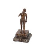 An Eastern bronze figure of a native man, on carved plinth 18cm high