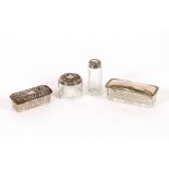 Four various silver topped dressing table jars