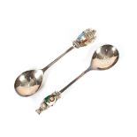 Two silver spoons, decorated with enamelled heraldic crests