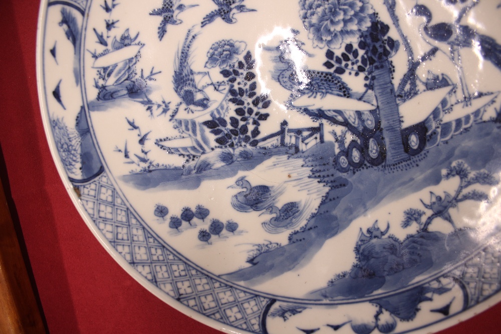 An 18th Century Chinese blue and white plate, the body profusely decorated with exotic birds and - Image 4 of 8