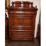 A mid 19th Century German figured mahogany fall front secretaire desk, the raised upper section