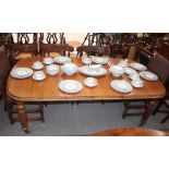 A Victorian mahogany extending dining table, fitted two extra leaves, raised on turned reeded