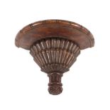 An Antique carved wooden wall bracket, with fluted and pineapple decoration, 32cm wide
