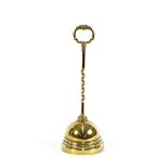 A 19th Century brass door stop, having twist column and loop handle, 46cm high