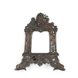 A decorative cast metal wall mirror, with cherub and dolphin decoration, 36cm x 26cm