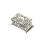 A late Victorian silver stamp box, having embossed foliate decoration and vacant cartouche to the