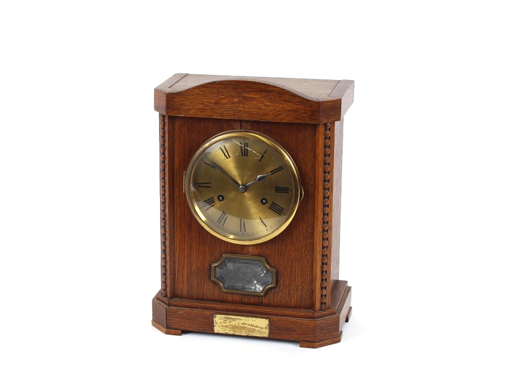 An oak mantel clock, by Junghans of Wurttemberg, retailed by John Purser & Sons, Portsmouth,