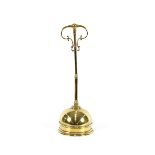 A 19th Century brass door stop, with loop handle, 47cm high