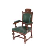 An Edwardian carved mahogany elbow chair; and a pair of similar dining chairs upholstered en suite