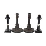 A pair of ebony and silver mounted candlesticks; and a pair of turned wooden 19th Century