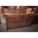 A 17th Century oak mule chest, the lid opening to reveal candle box interior, carved triple panels