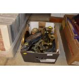 A box containing various brass and copper items to