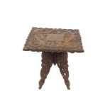 An Eastern carved hardwood occasional table, the s