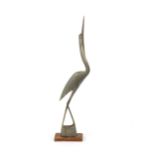 An Art Deco design horn model of a crane, on woode