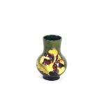 A small Moorcroft baluster vase, decorated flower