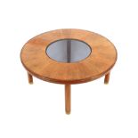 A teak G-plan circular coffee table, inset glass to